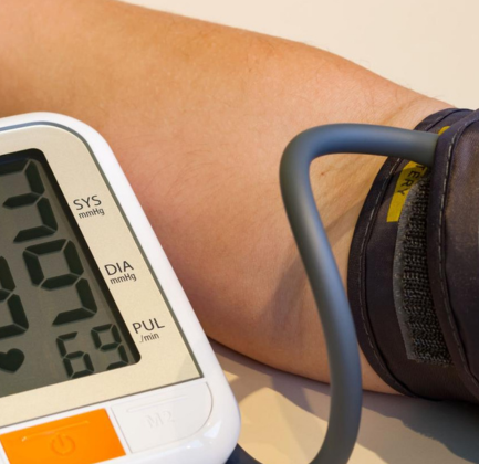 Pharmacist checking blood pressure